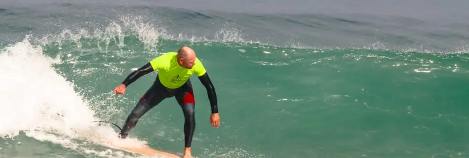 Surfer riding wave with advanced technique