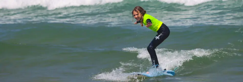 Beginner surfer catching their first green wave