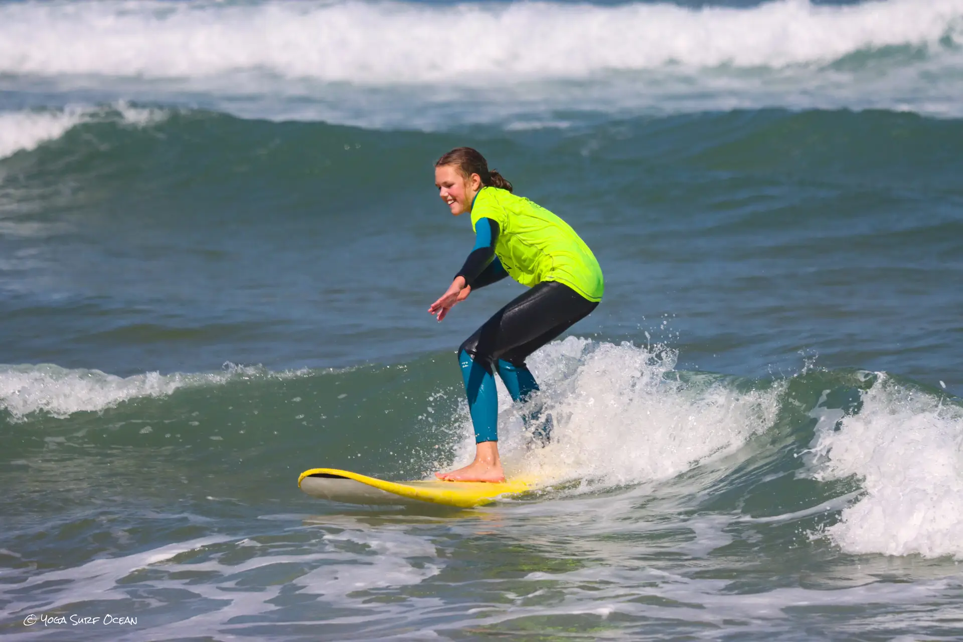 Surfer on turquoise wave