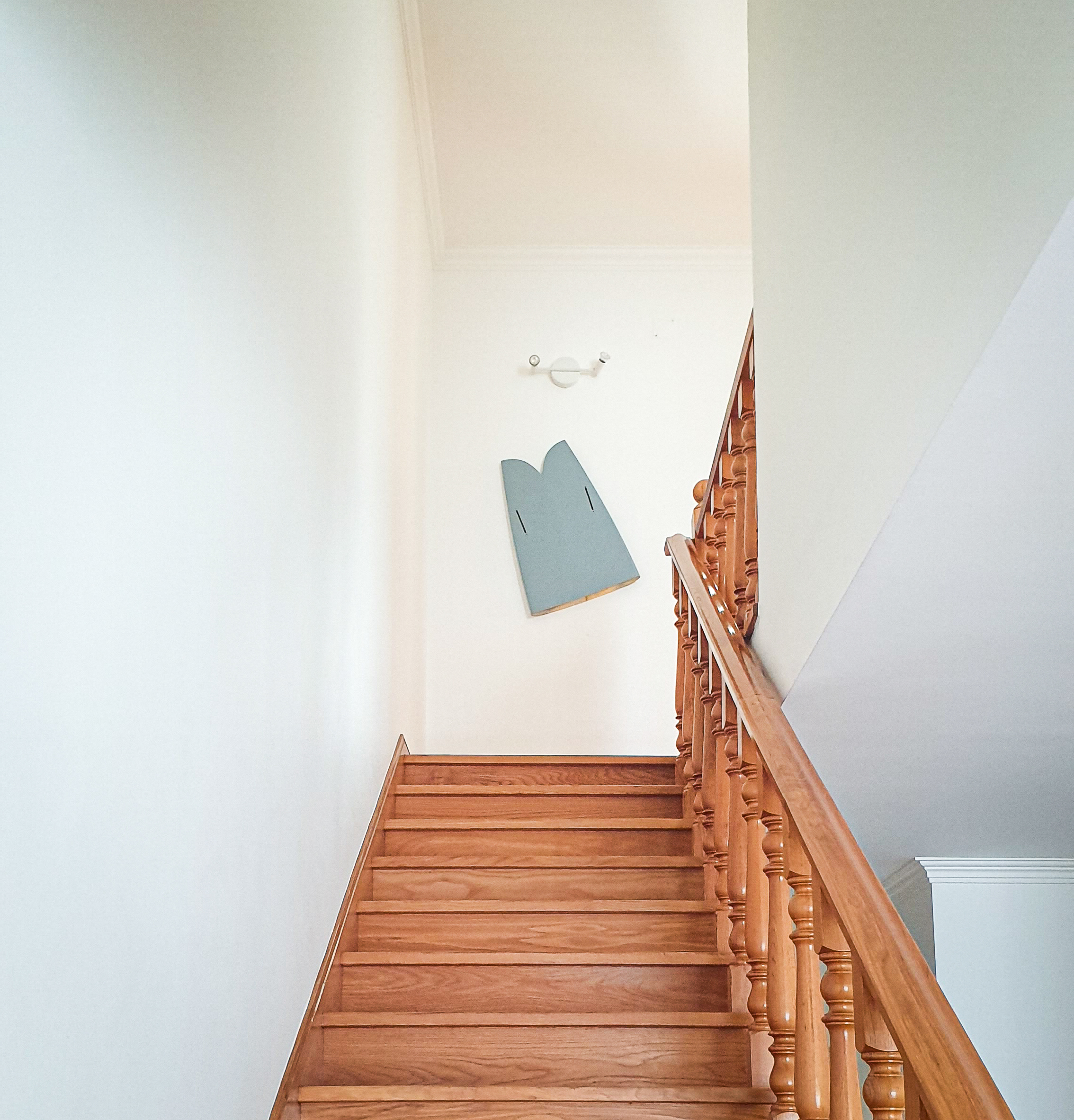 Santa Cruz â€” wooden stairs and surfboard art, calm coastal home